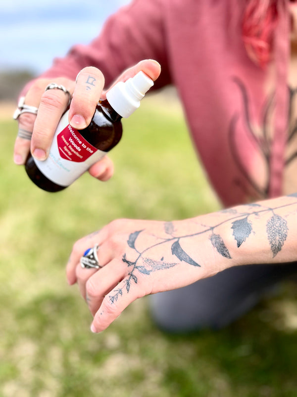 Applying insect repellent spray